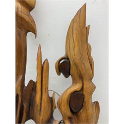 Helen Skelton (British 1933 – 2023): Large abstract wooden wall sculpture, H175cm, W53cm. Born into an RAF family in 1933 in Kent and travelled the world extensively during her childhood. After settling in Bridlington, Helen immersed herself in painting, textiles, and wood sculpture, often inspired by nature's beauty. Her talent was showcased in a one-woman show at Sewerby Hall and recognised with the sculpture prize at Ferens Art Gallery in 2000. Sadly, Helen’s daughter passed away from cancer in 2005. This loss inspired Helen to donate her sculptures to Marie Curie upon her passing in 2023.