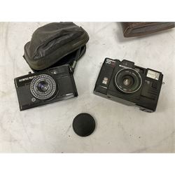 Quantity of cameras and accessories to include Olympus Trip 35, Minolta A f-EII 35mm, Yashica Auto Focus camera, Hanimex 35mm af camera in case, Kodak No.2A Folding Pocket Brownie camera in case, Minolta VLT-501 lens, etc