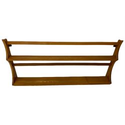 Ercol medium elm two tier wall plate rack, and additional Ercol two tier wall plate rack, with glass shelf and swan detail. 