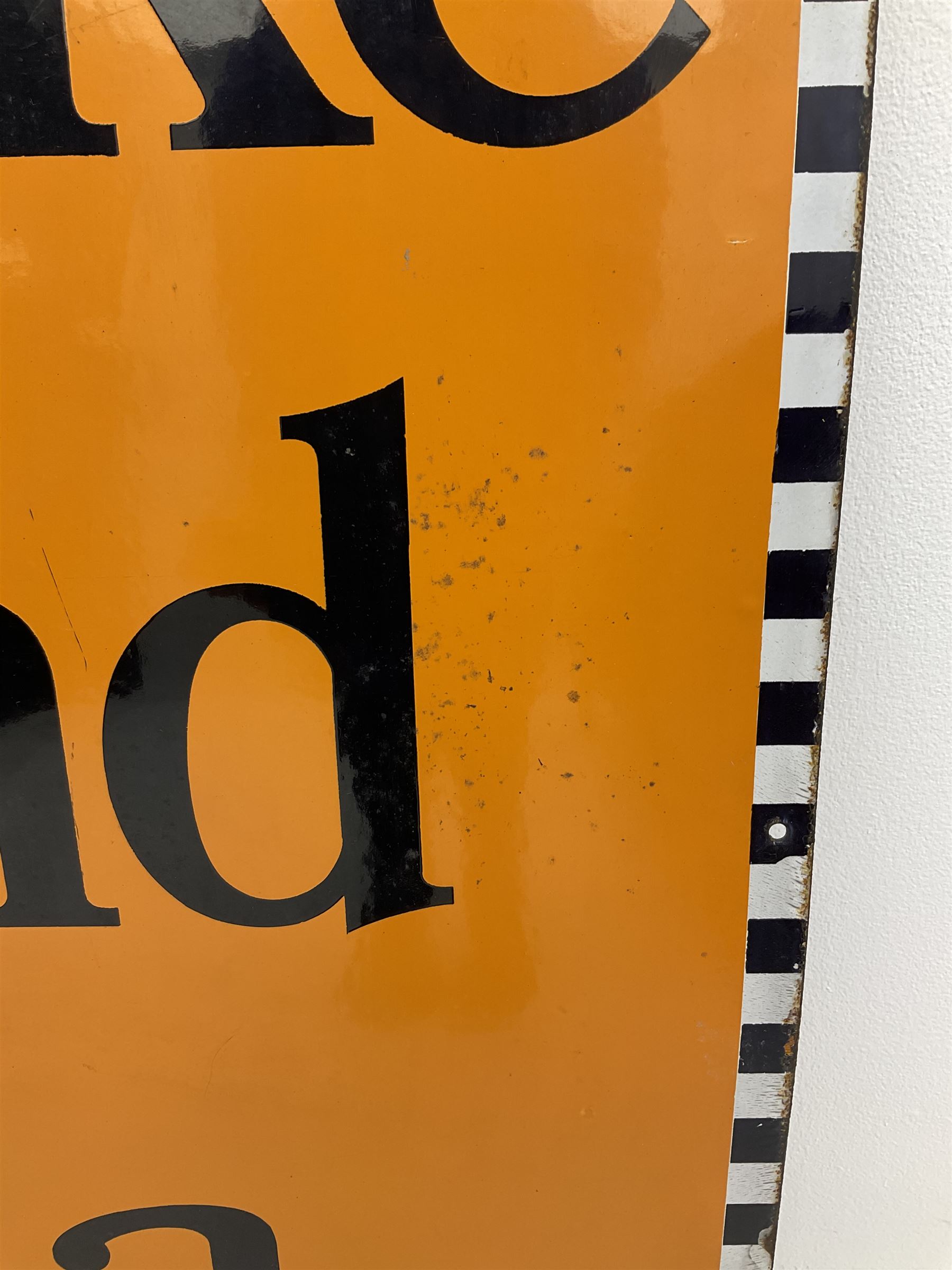 A large enamel advertising sign for Brooke Bond tea, detailed 'Brooke Bond Tea is good tea' in black lettering upon an orange ground with black and white chequered border, H101.5cm, W76cm. 