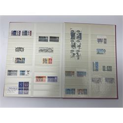 Mostly Great British stamps, including King Edward VII two shillings and sixpence, five shillings and ten shillings, King George V seahorses, King George VI high values, Queen Elizabeth II pre and post decimal etc, housed in a pink stockbook 