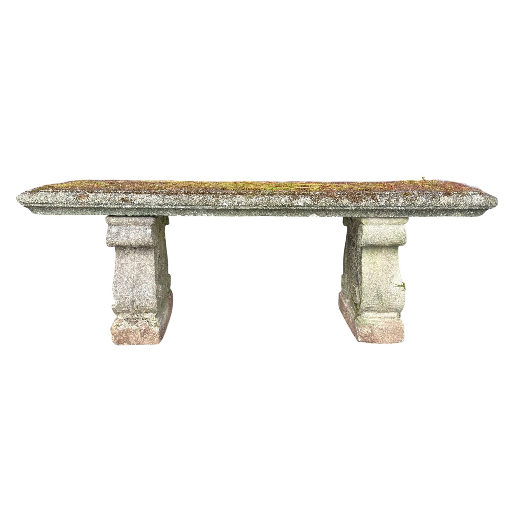 Weathered cast stone three piece bench, the rectangular seat with moulded edge, raised on Neoclassical style end supports with S-scrolls and fruiting grapevines, on rectangular bases