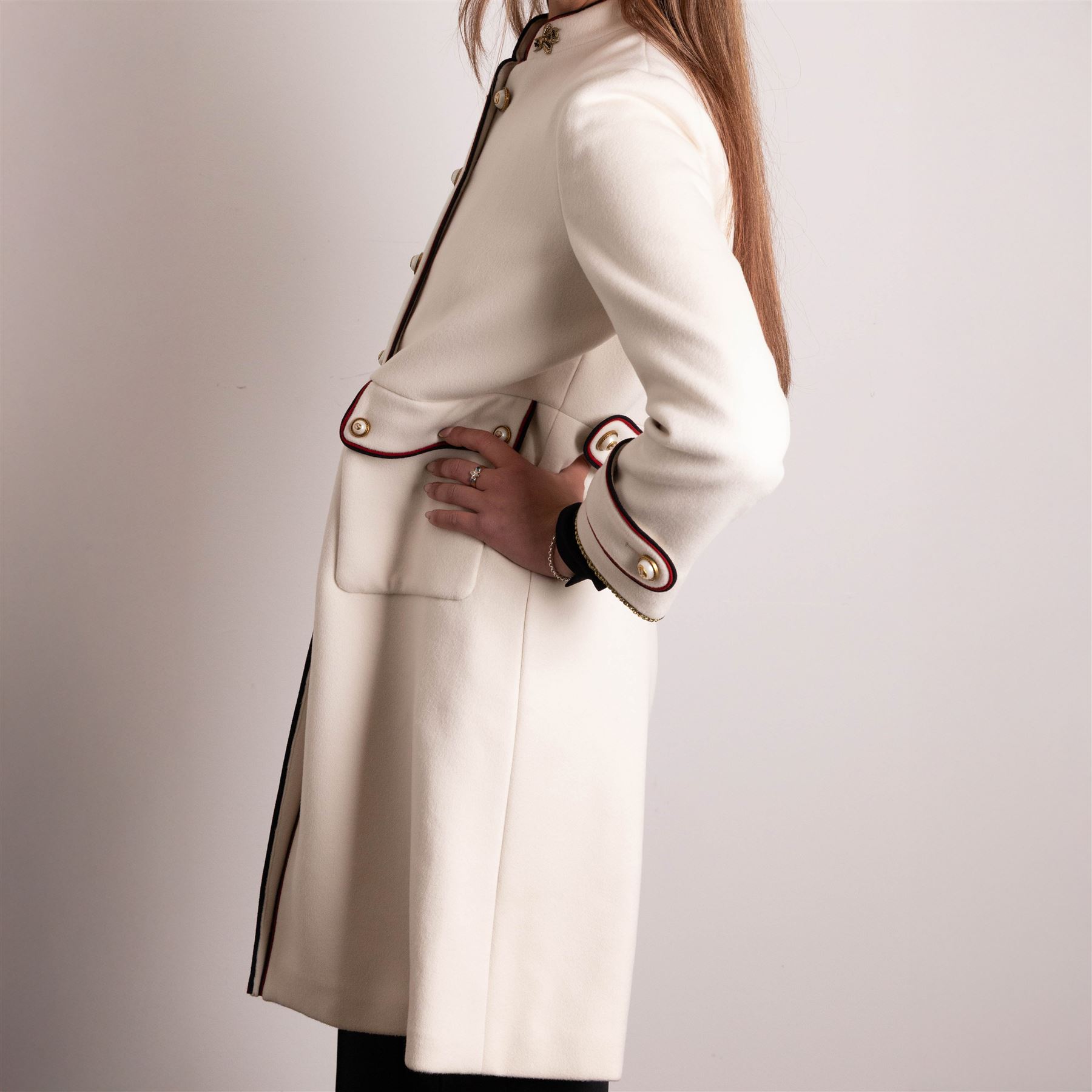 Gucci - bee embroidered wool single-breasted military coat, from the Autumn/Winter 2017 collection under Alessandro Michele, in ivory, with stand collar, red and navy trim, pearlescent and gold-tone button fastening and embroidered bee detailing to the collar, size 14, unused with original garment bag and tags