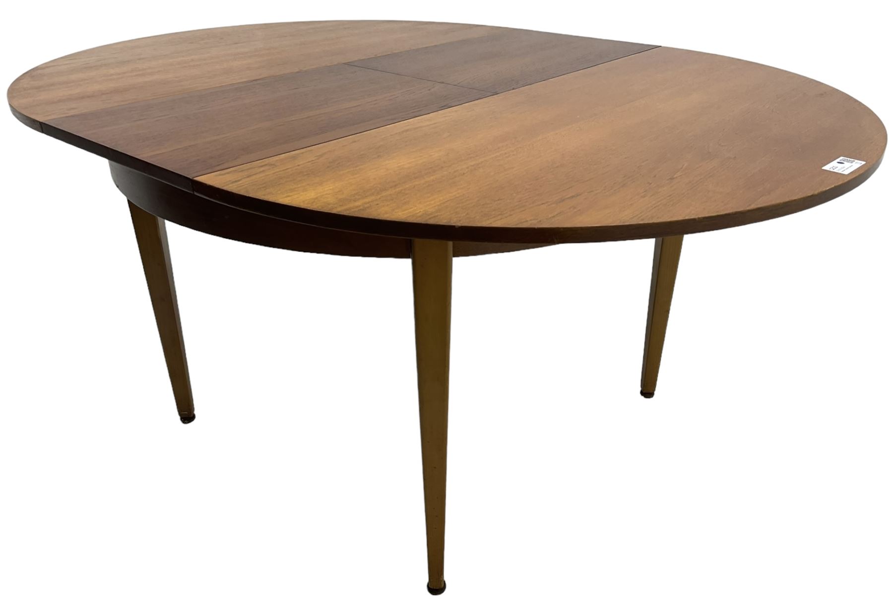G-Plan - mid-20th century teak extending circular dining table, with concealed additional leaf (W114cm, H72cm); and a set of four mid-20th century teak dining chairs, seat upholstered in beige fabric