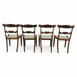 Set of four 19th-century rosewood dining chairs in the William IV style, shaped and carved top rail with fan and scroll decoration above a upholstered padded seat on reeded and turned front legs 