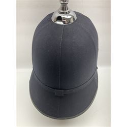 Police - Victorian turned hardwood truncheon with traces of decoration and VR cypher L42cm; Humberside Police helmet with Queens Crown helmet plate; hand lamp inscribed 'The Inspector'; and small pair of pewter figures of police officers (5)