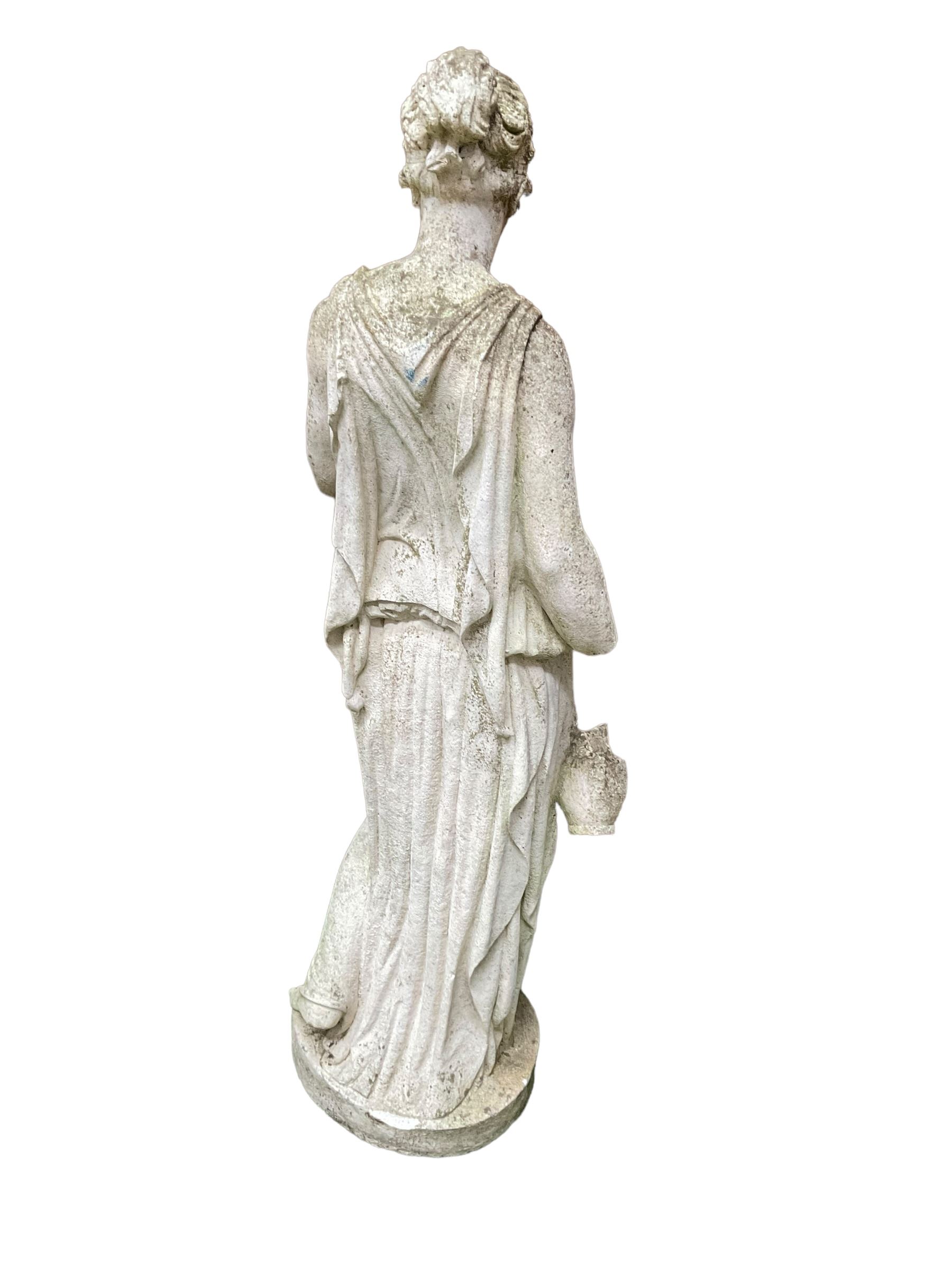 Cast stone garden figure of a lady