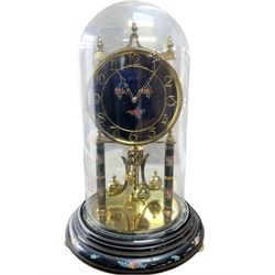 Kundo 1960’s torsion clock with a skeleton movement and four ball oscillating pendulum, with a glass dome. Torsion spring intact.