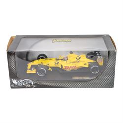 Three signed limited edition 1:18 scale Formula One models, comprising Hot Wheels Jordan EJ12 signed by Takuma Sato, Hot Wheels Jaguar Racing R2 signed by Eddie Irvine and a Minichamps Williams F1 Team model signed by Jenson Button, 1:18 scale model, all boxed