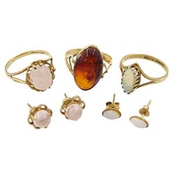 Gold opal ring, with similar pair of earrings, gold rose quartz ring, with matching pair of gold earrings and a single stone amber ring, all 9ct