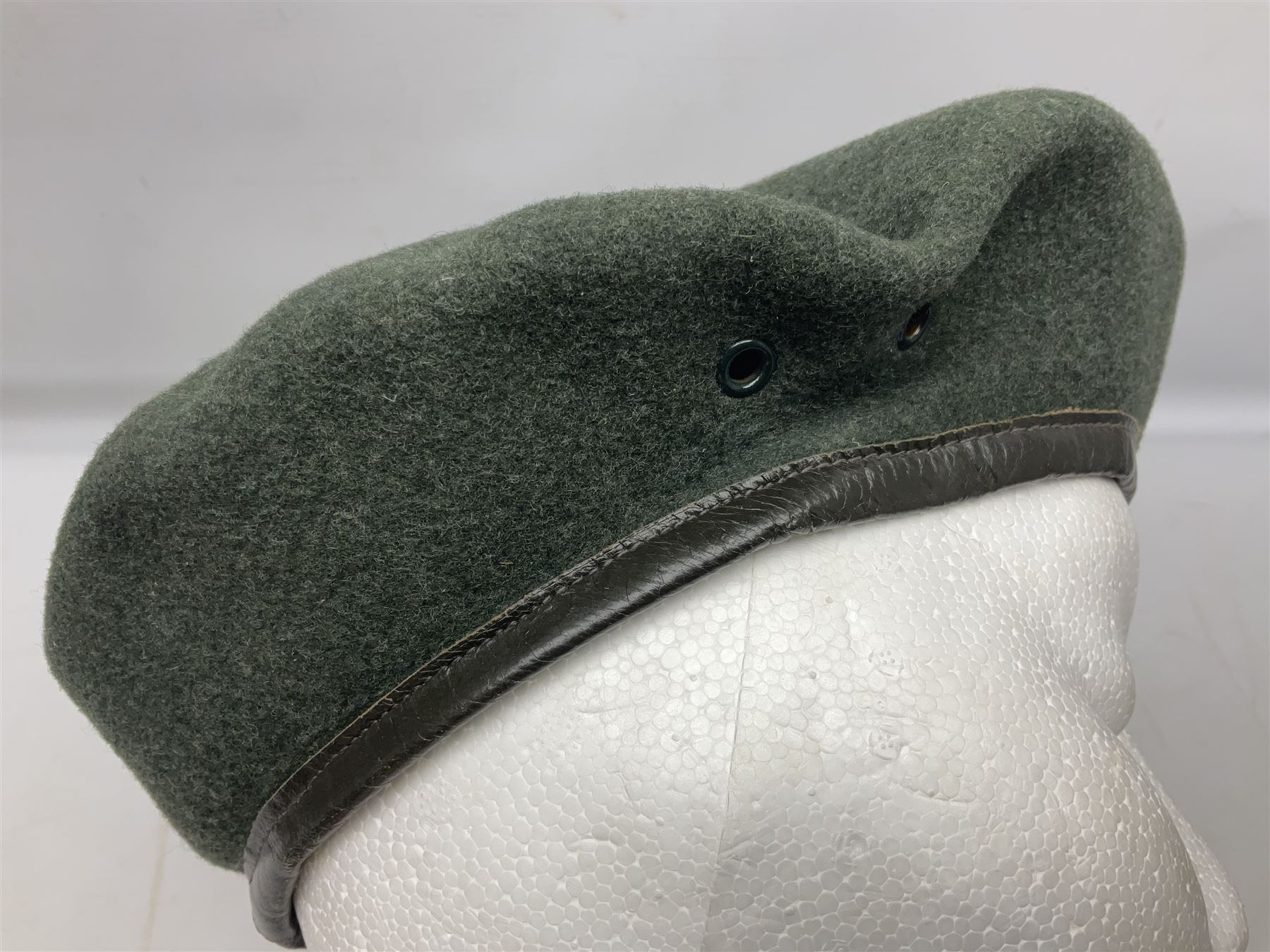 Four paratrooper berets - Russian, Italian, British and Foreign Legion; all with badges (4)