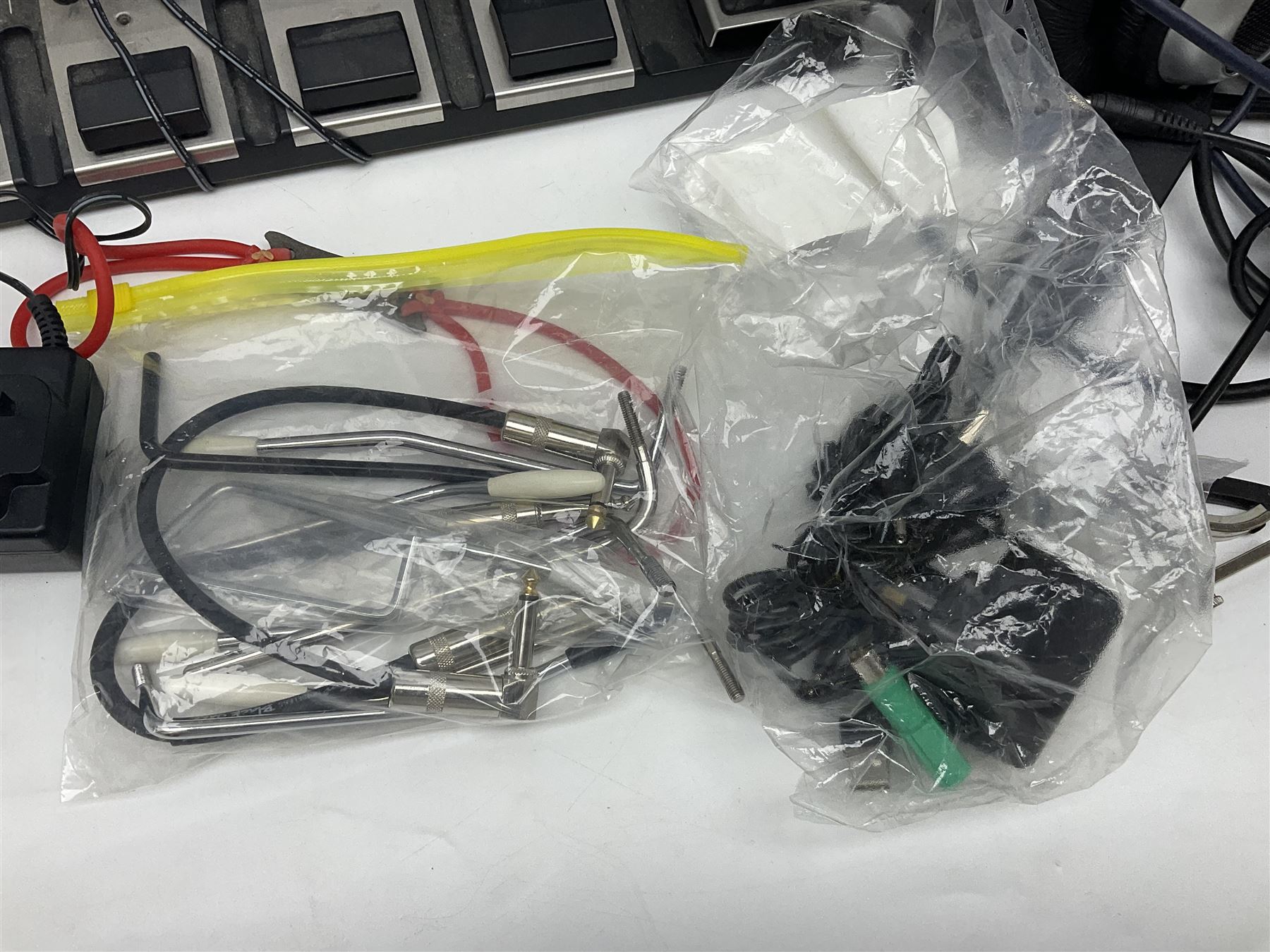 Zoom GFX-4 Guitar Effects processor; quantity of assorted cables; tremolo arms; plectrum wallet; Steepletone SMH10 earphones etc