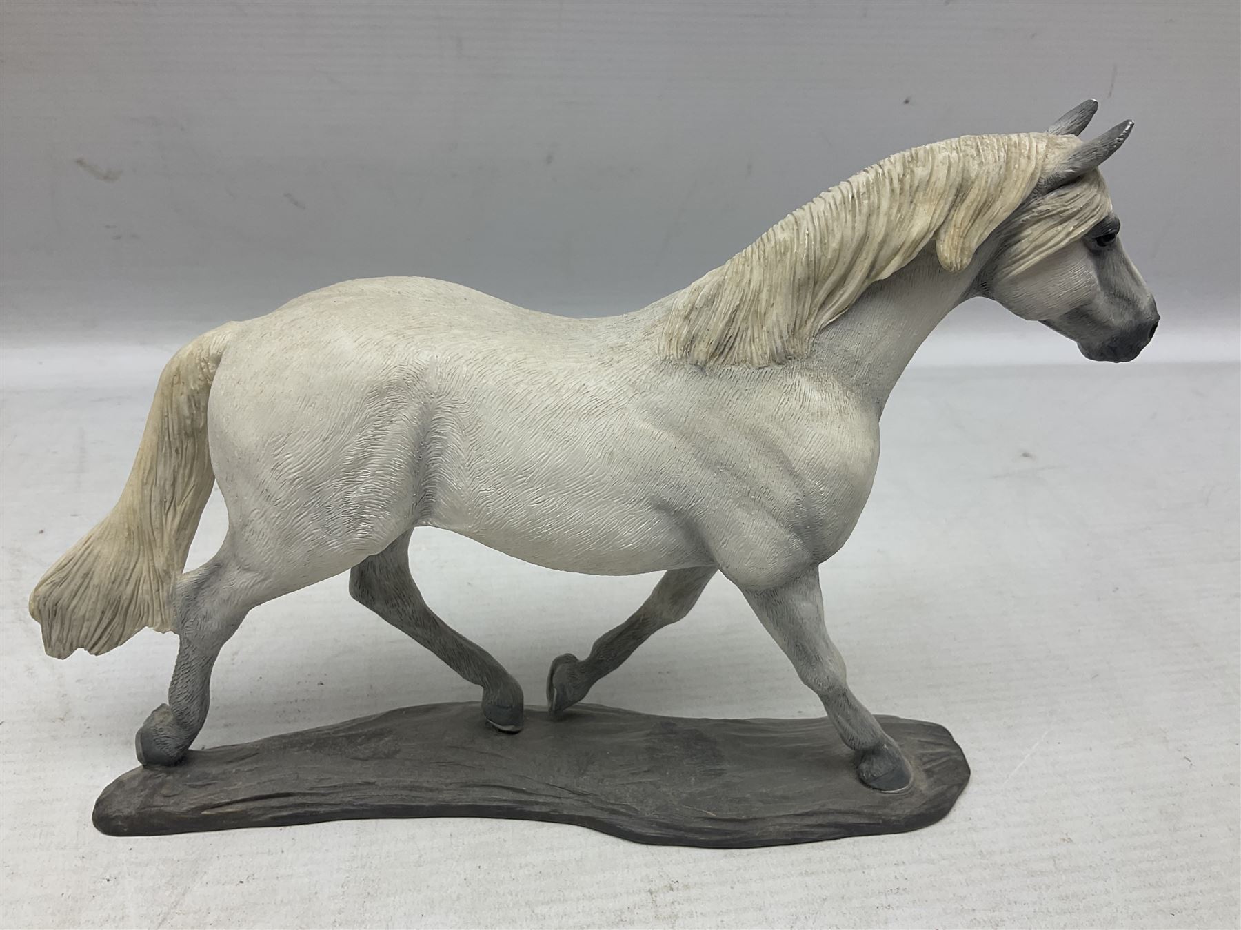 Seven Border Fine Arts figures, comprising Clydesdale Mare & Foal A0187, Highland Mare & Foal A2691 and five horses from the Action Horses series 