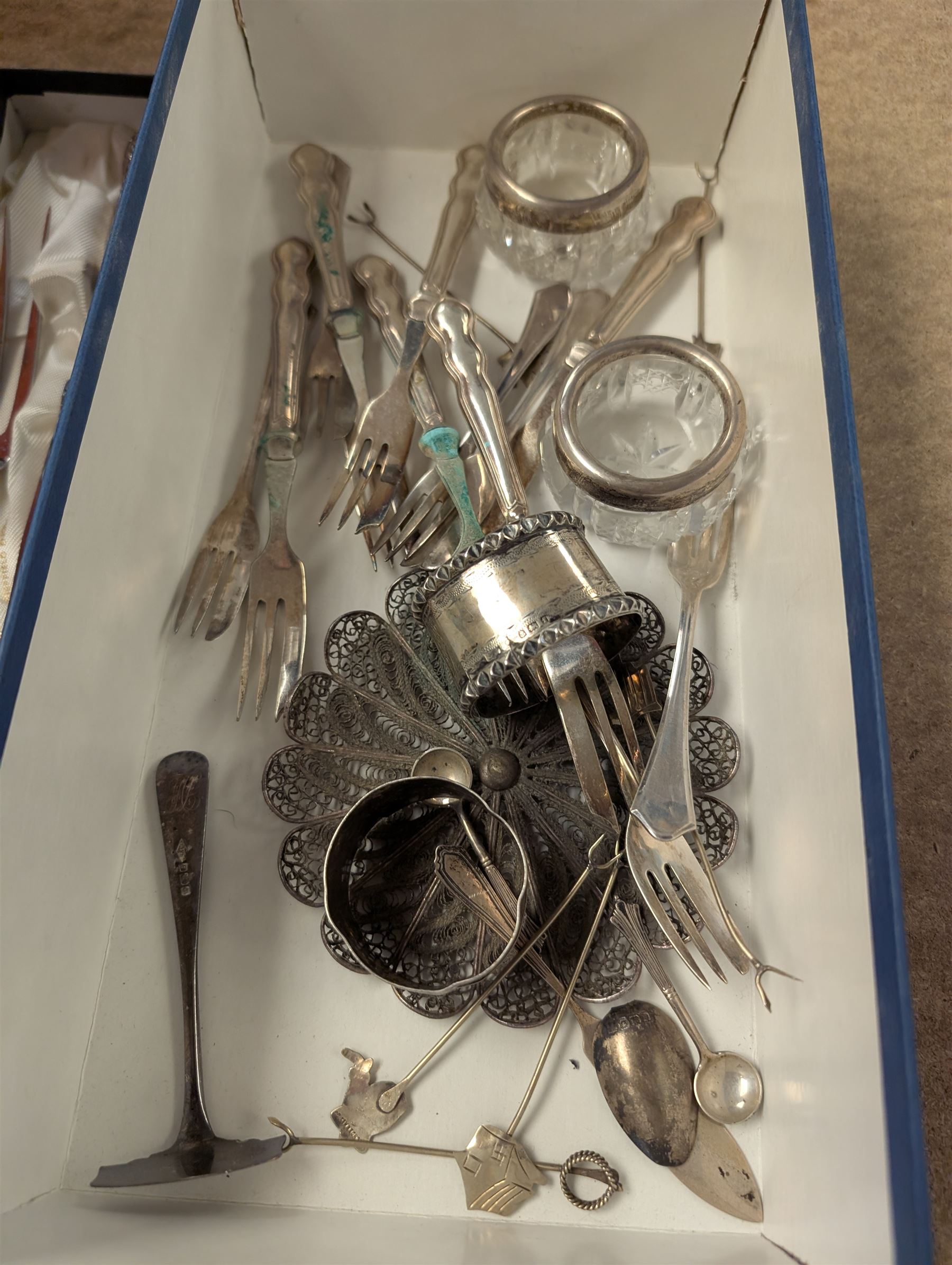 Group of silver, including set of six cake forks, two napkin rings, set of six silver-handled cake forks, silver-handled carving set, etc 