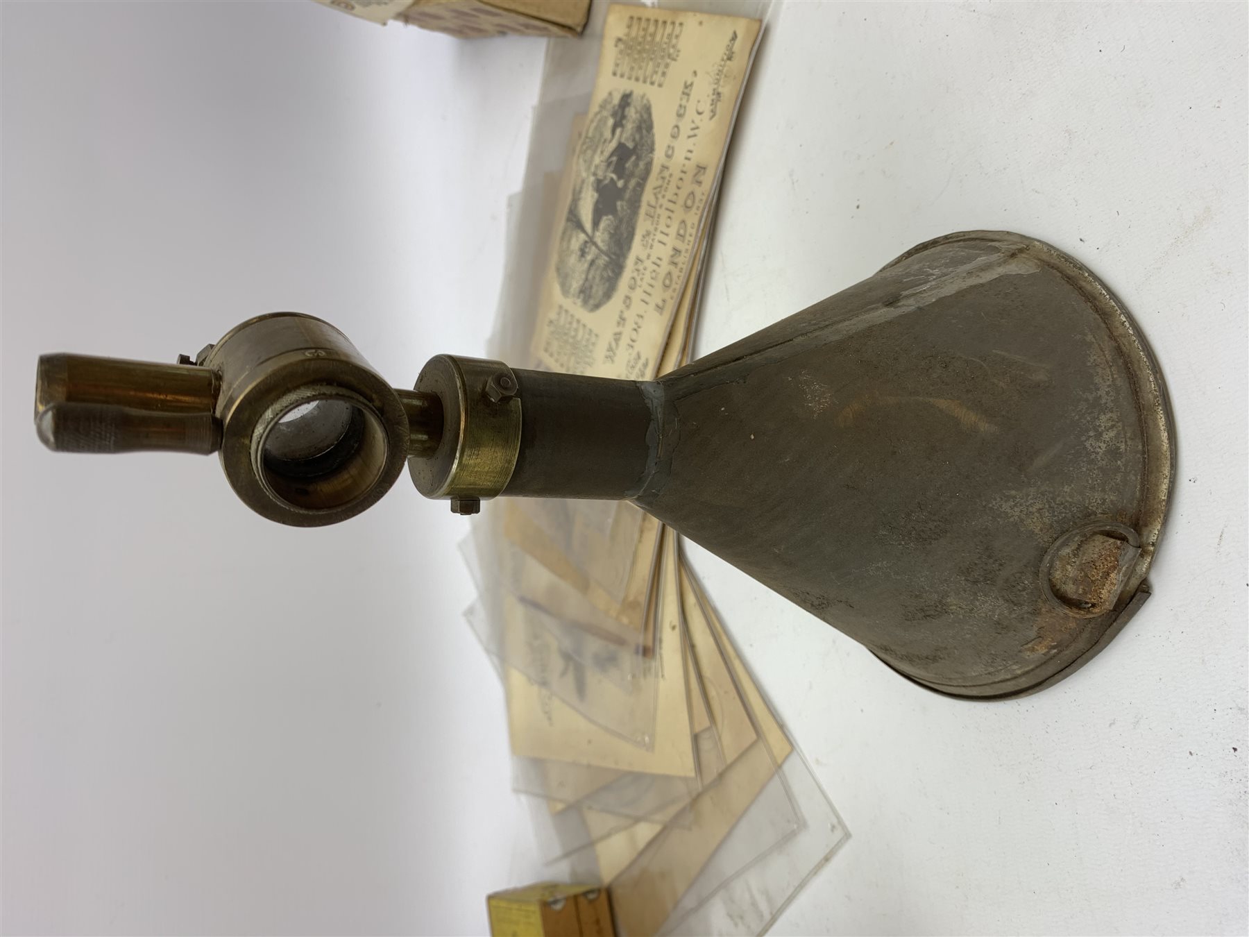 Brass and tin powder magazine by B.E. Chaplin of conical form with glazed see-through nozzle H27cm; eight reprinted gun case labels for Holland & Holland, Thomas Jackson & Son, William Ling, Watson & Hancock, Williams & Powell etc; and quantity of empty cartridge boxes and pellet tins