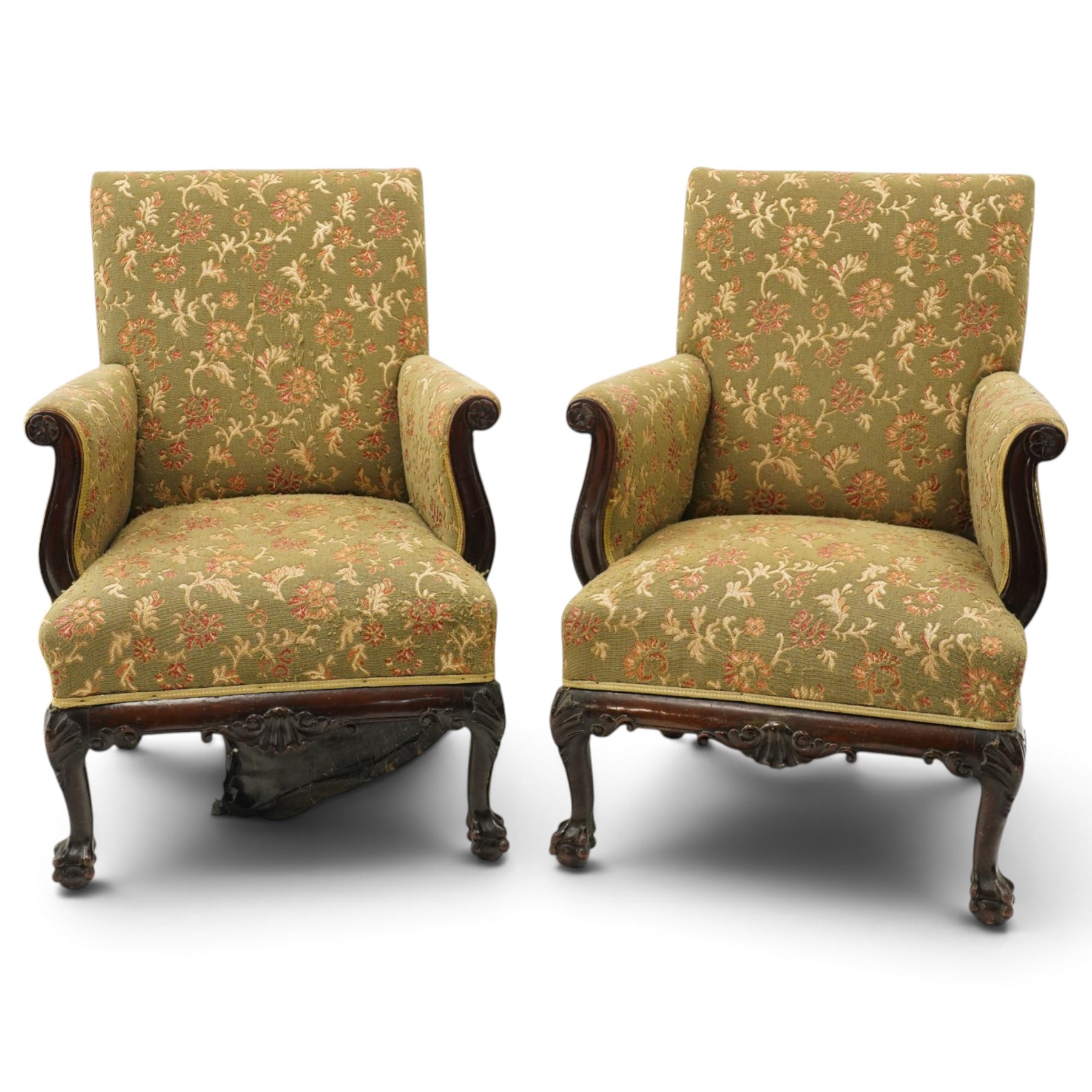 Pair of Chippendale design carved mahogany framed armchairs of stylised lyre form, high square backs and sprung seat upholstered in olive-ground foliate fabric, scrolled arm terminals with applied rosettes, the seat rail moulded with central scallop-and-acanthus motif, raised on shell-carved cabriole supports with ball-and-claw feet