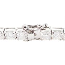 18ct white gold diamond bracelet, forty round brilliant cut diamonds , in a four claw setting, stamped 18K, total diamond weight 12.26 carat, with World Gemological Institute report