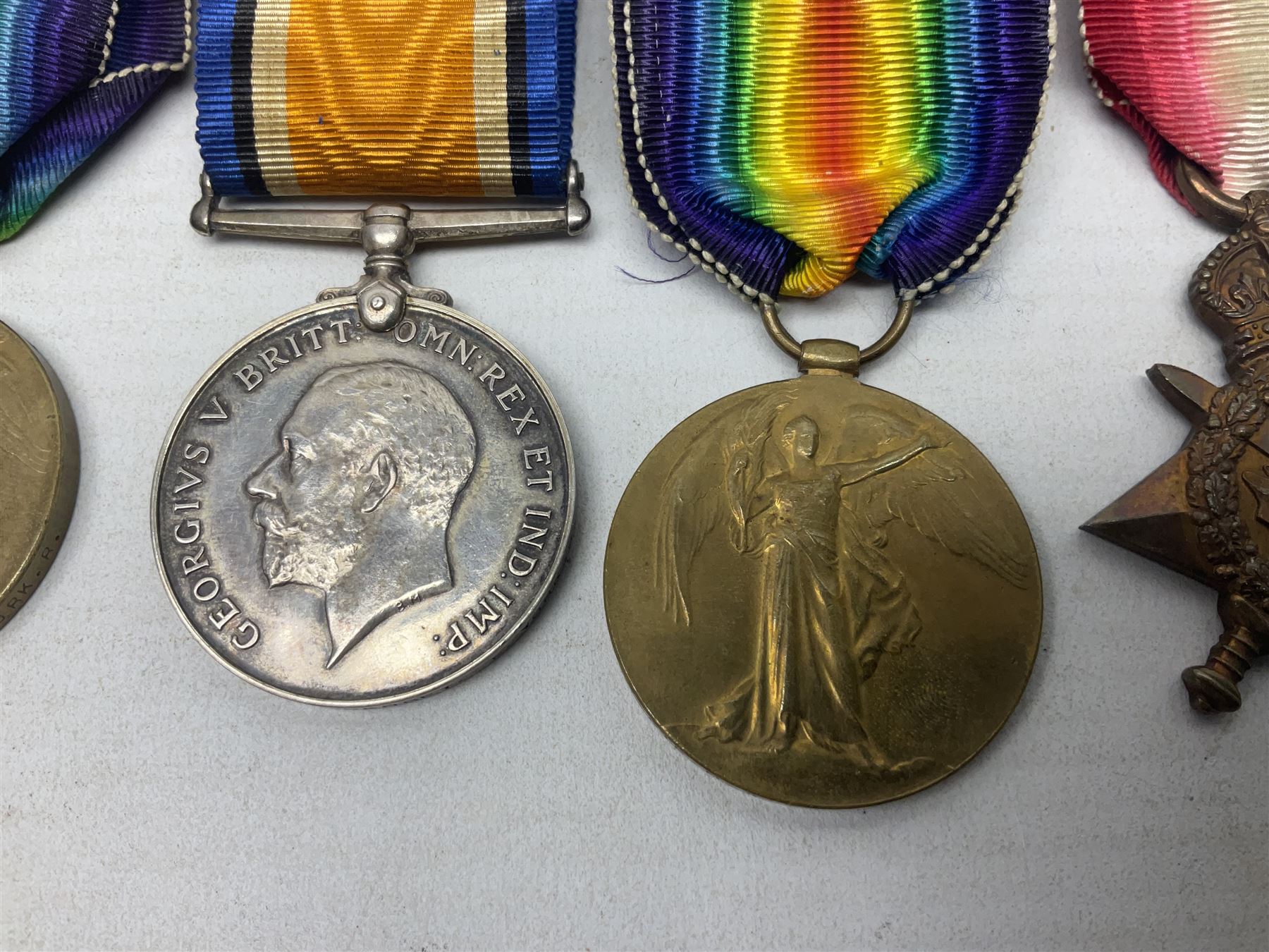 Family group of five WW1 medals for the East Yorkshire regiment comprising trio of 1914-15 Star, British War Medal and Victory medal awarded to 13-368 Pte. C. Padget; and British War Medal and Victory Medal to 201829 Pte. H.W. Padget; all with ribbons (5)