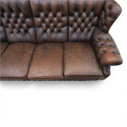 Georgian design Chesterfield lounge suite, comprising highbacked four seat sofa and pair armchairs, upholstered in chocolate brown leather, Armchairs (H 90cm, W 91cm) Sofa (H 91cm, W 238cm)