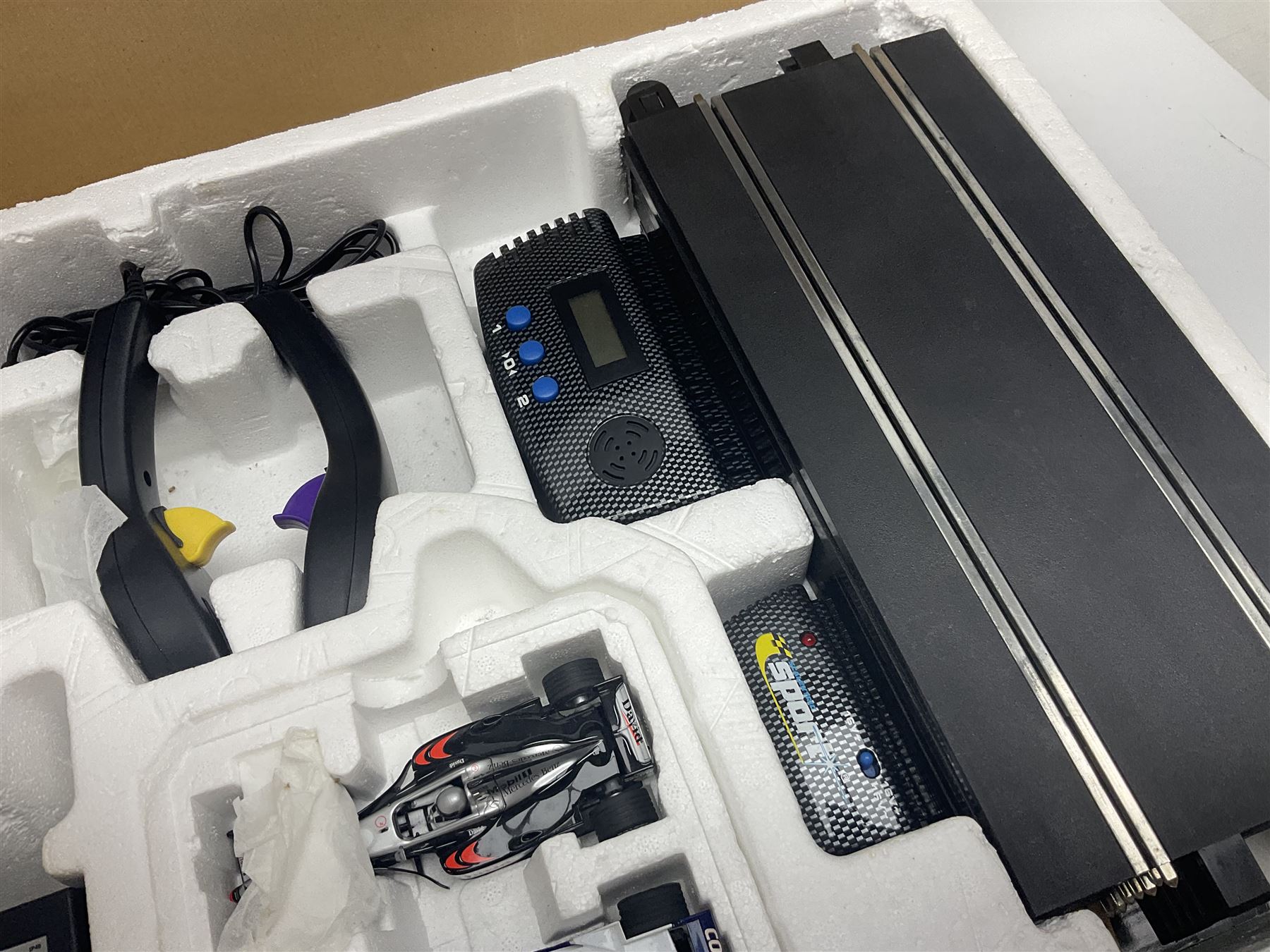 Scalextric - Formula One set with McLaren Mercedes and Williams BMW cars; and Speed Extreme set with Ford Focus cars; both boxed with accessories and paperwork; and Parker Pro-Action football game; boxed (3)