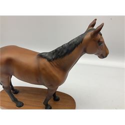 Beswick 'Mill Reef' horse figure, on a wooden plinth together with Beswick Ware horse figure 'Red Rum' on wood plinth, both with printed mark beneath
