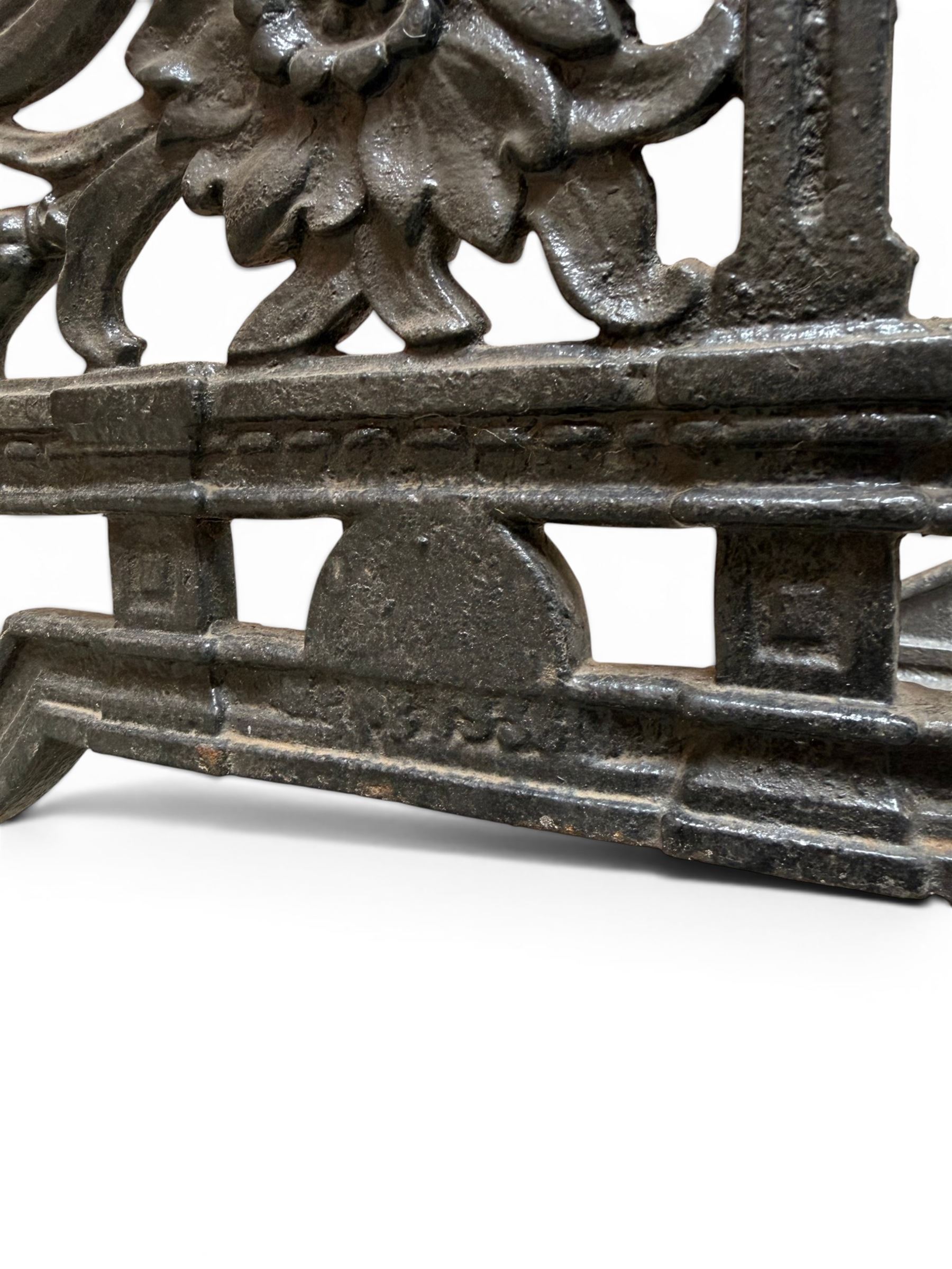 Yates Haywood - pair of Victorian cast iron bench ends, Architectural scrolling design with flower head detail, stamped with period registration number and date