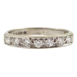 18ct white gold channel set seven stone round brilliant cut diamond half eternity ring, London 1976, total diamond weight approx 0.25 carat