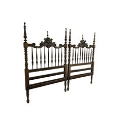 Pair Spanish stained beech single 3' bedsteads, spindle turned backs and carved with scrolling floral decoration 