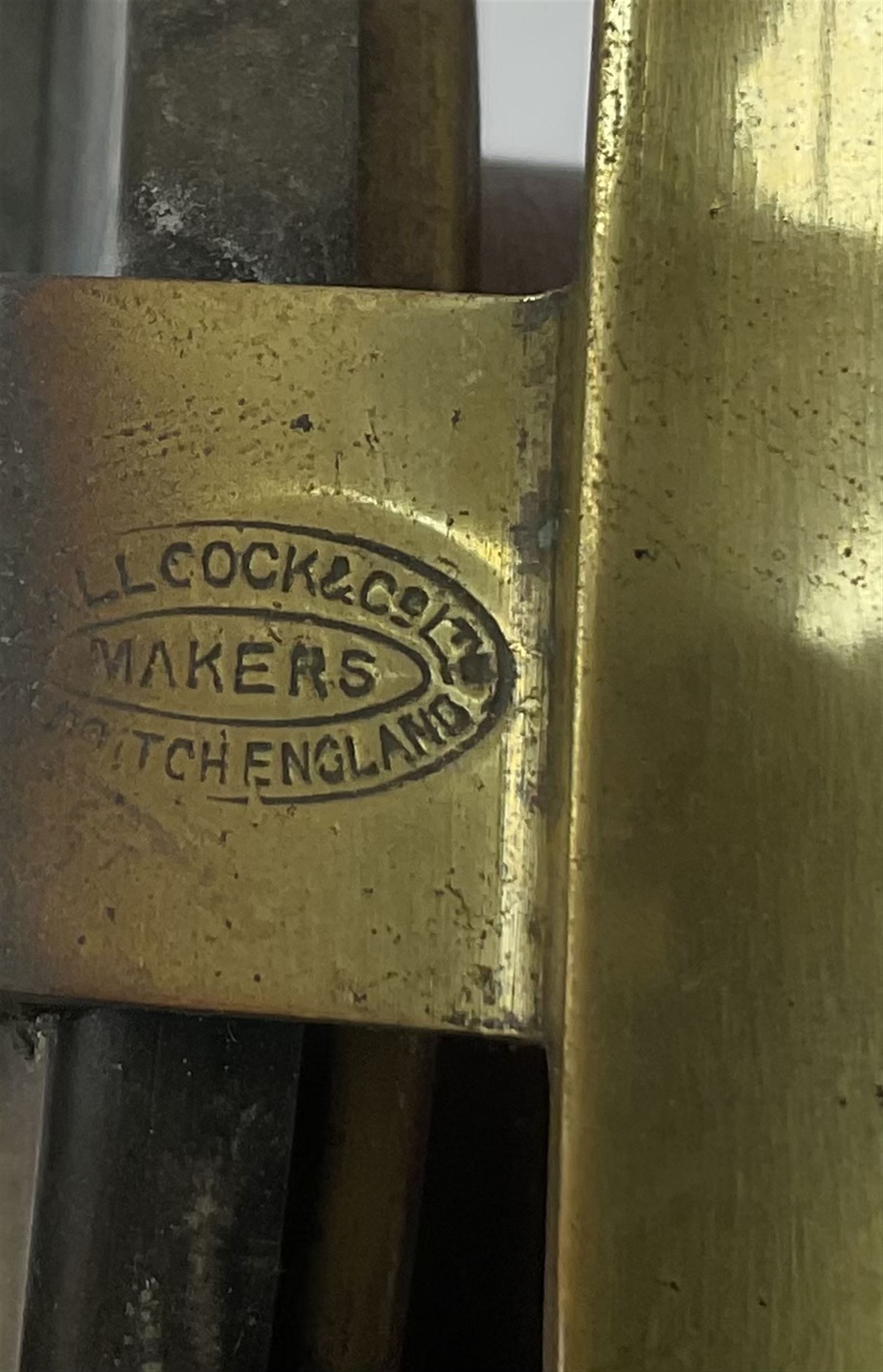 Three Allcocks & Co Ltd reels of brass and wood construction, the largest D4.5 inches