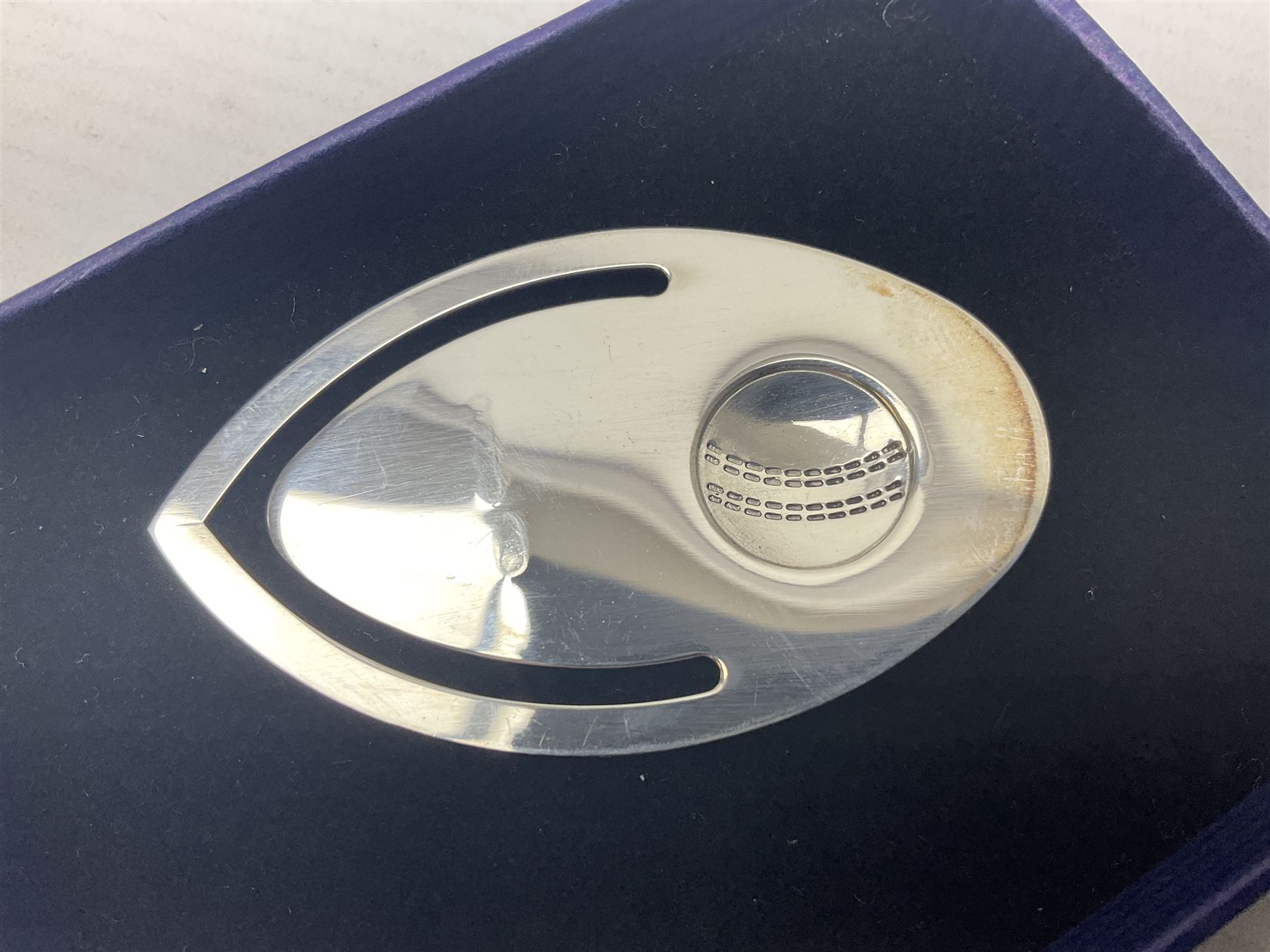 Modern silver bookmark, embossed with cricket ball, hallmarked Laurence R Watson & Co, Birmingham 2003, H6cm, boxed 