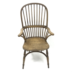  20th century elm high back Windsor armchair, turned supports joined by a crinoline stretcher, W65cm  