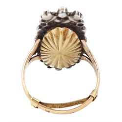 18th / 19th century silver and gold diamond and sapphire portrait ring, set with an oval miniature of a woman wearing a bonnet on ivory, under a glazed panel, surmounted with a 'trophy of love' symbol, modelled as a flaming torch and bow and quiver, set with a single round cut sapphire and rose cut diamond surround, to trifurcated shoulders, on French 18ct gold shank, Eagle hallmark. This lot has been registered for sale under Section 10 of the APHA Ivory Act