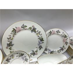 Royal Worcester June Garland pattern tea and dinner wares, comprising thirteen dinner plates, twelve dessert plates, twelve side plates, six twin handled soup bowls and six saucers, six small bowls, sauce boat and stand, thirteen teacups and fifteen saucers, open sucrier, and milk jug