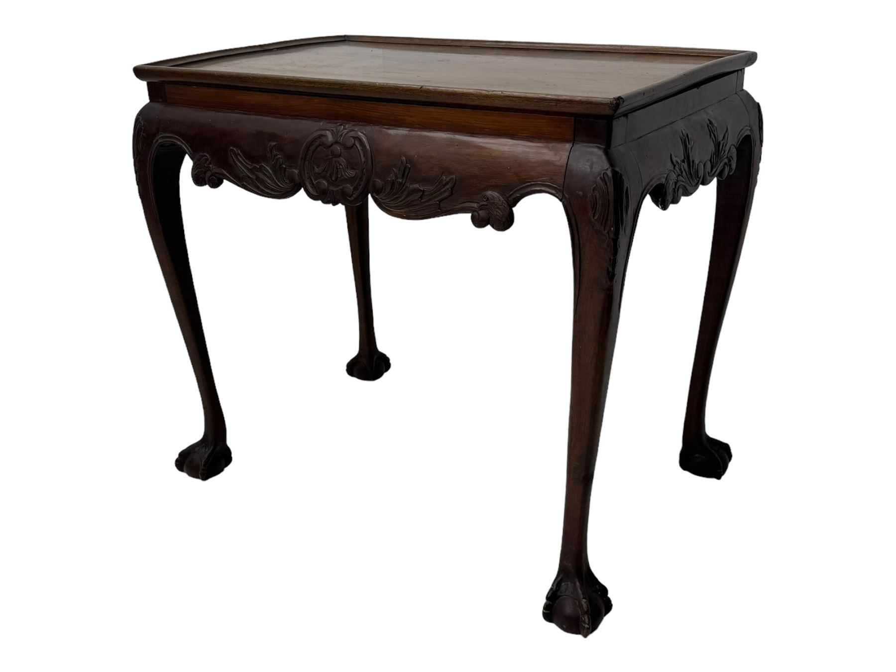 Late 19th to early 20th century mahogany side table, rectangular top with applied raised moulding, curved upper rails carved with C-scroll cartouches and extending curled leaves, bellflower carved cabriole supports with ball and claw feet 