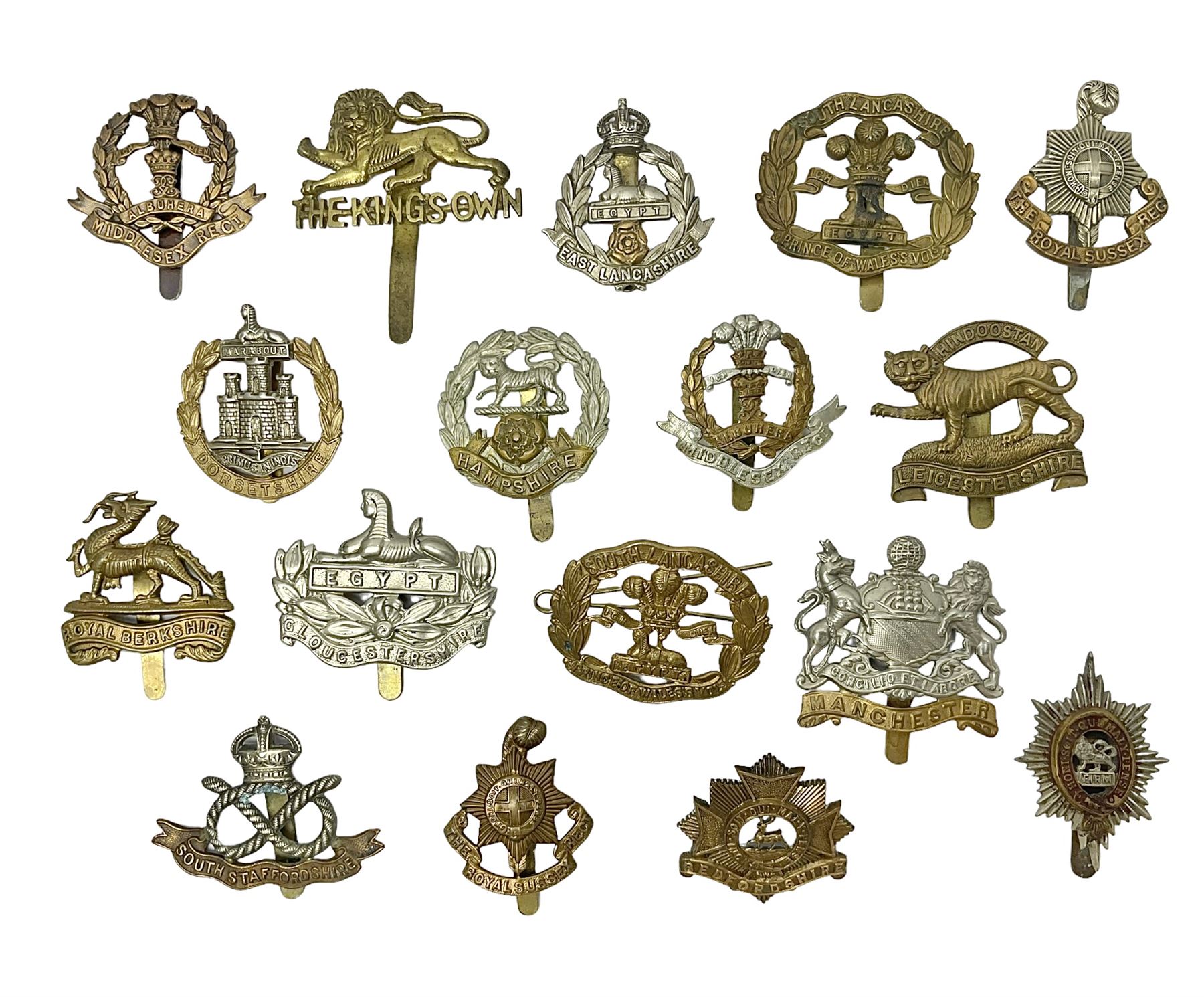 Seventeen regimental cap badges including Dorsetshire, Worcestershire, Staffordshire, Lancashire, Manchester, Middlesex, Berkshire, Bedfordshire etc (17)
