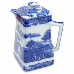 Large Spode Italian blue and white jug H23cm, 20th century Delft vase and cover decorated with landscape and floral design H38cm, Ringtons Tea Merchants blue and white tea caddy H20cm and a Ringtons jug (4)