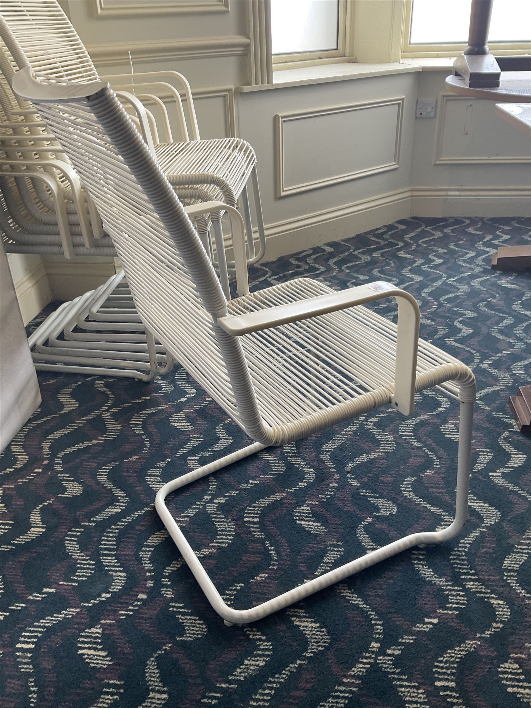 Eight white wicker garden armchairs- LOT SUBJECT TO VAT ON THE HAMMER PRICE - To be collected by appointment from The Ambassador Hotel, 36-38 Esplanade, Scarborough YO11 2AY. ALL GOODS MUST BE REMOVED BY WEDNESDAY 15TH JUNE.