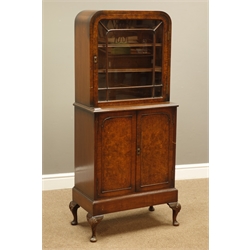  Early to mid 20th century walnut dome top cabinet, glazed door above double cupboard, W58cm, H135cm, D32cm  