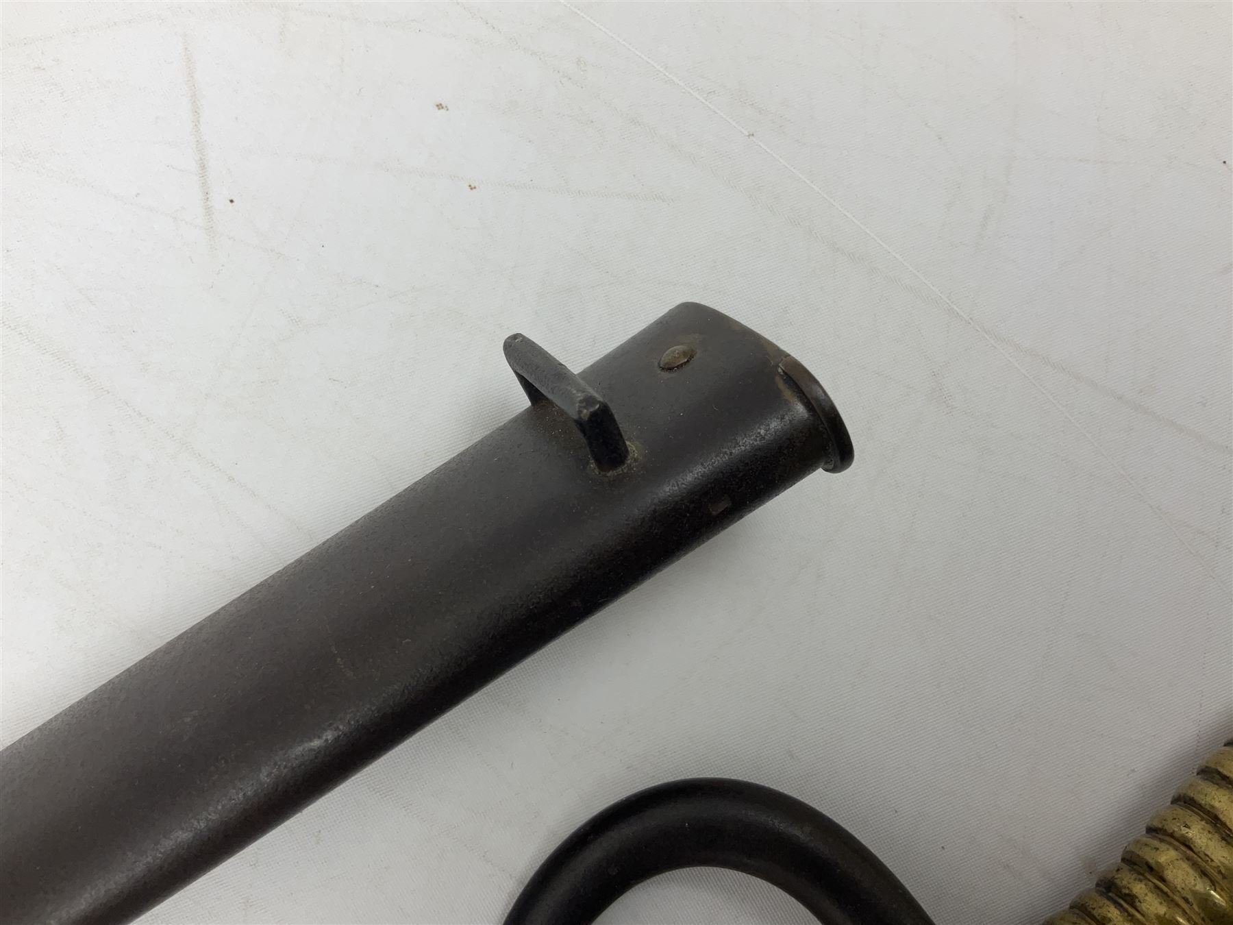 French model 1866 sabre bayonet, the 57.5cm curving blade marked St. Etienne 1868; in associated steel scabbard L71cm overall