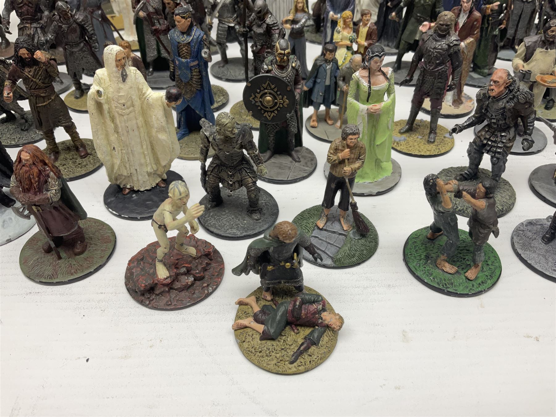 Approximately 80 NLP Lord of the Rings heavy metal painted figurines to include Fell Beast, boxed, and The Watcher, The Dark Lord Sauron, Treebeard etc, and unassociated Dracula themed composite figures marked HHFT50 