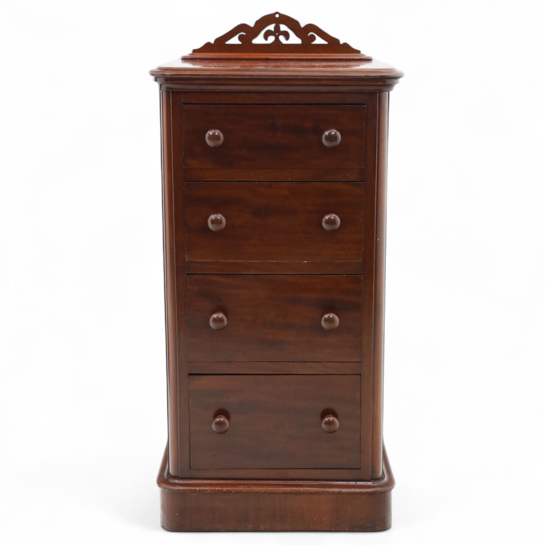 Pair of tall Victorian mahogany bedside chests, of narrow upright form, rectangular top with moulded edge, the back with raised pierced fretwork gallery, above four graduated drawers with knob handles, raised on a plinth base 