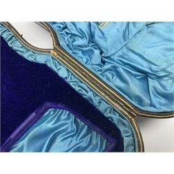 Victorian three-piece silver tea service, comprising teapot, twin handled open sucrier and milk jug, of oval form with shaped rim and C handles, each engraved with crests and bands of strapwork decoration, the milk jug and sucrier with gilt interiors, hallmarked Josiah Williams & Co, Exeter 1881, the teapot with ivory insulators and finial, all contained with a tooled leather, blue silk and velvet lined fitted case, retailed by West & Sun, Dublin 
This item has been registered for sale under Section 10 of the APHA Ivory Act