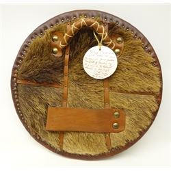  Replica Scottish Highlander's Targe by Joe Lindsay, based on an original targe dated 1755 which which is inscribed with 'James Goodlate Campbell of Achline', the wooden shield covered in tooled leather with traditional Celtic designs, brass studs and mounts with deer skin hide verso, D49cm   