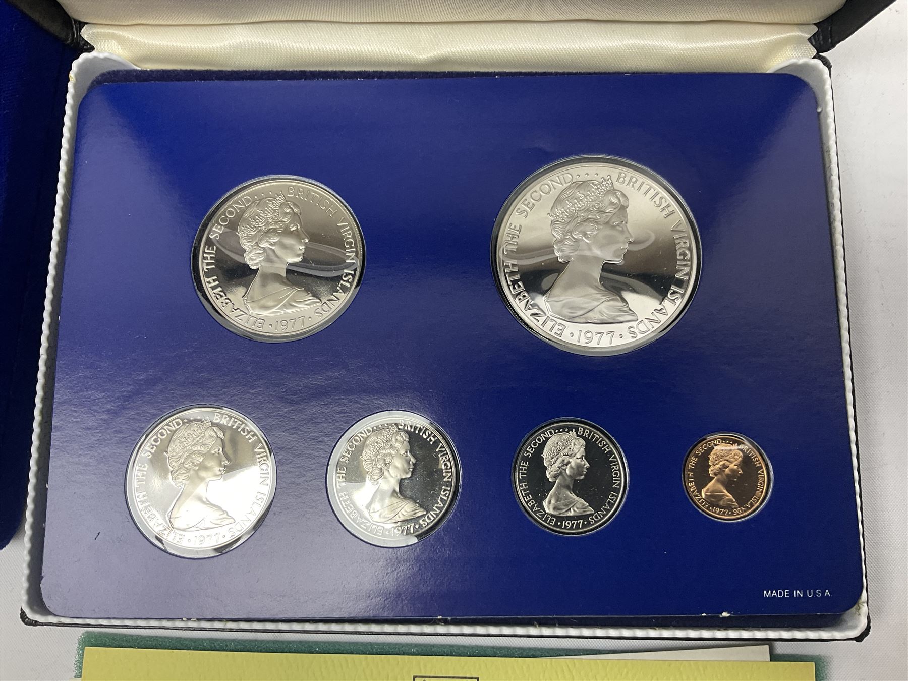 Four British Virgin Islands proof coin sets, comprising First Coinage of the British Virgin Islands 1973 proof six coin set, containing silver one dollar coin, 1977 and 1979 proof sets, containing high denomination silver coins, and The Royal Coronation Jubilee 1977 six coin silver proof set, each minted at the Franklin Mint, all cased with certificates, and a Solomon Islands 1978 proof seven coin set, containing silver five dollar coin, minted at the Franklin Mint, cased with certificate (5)