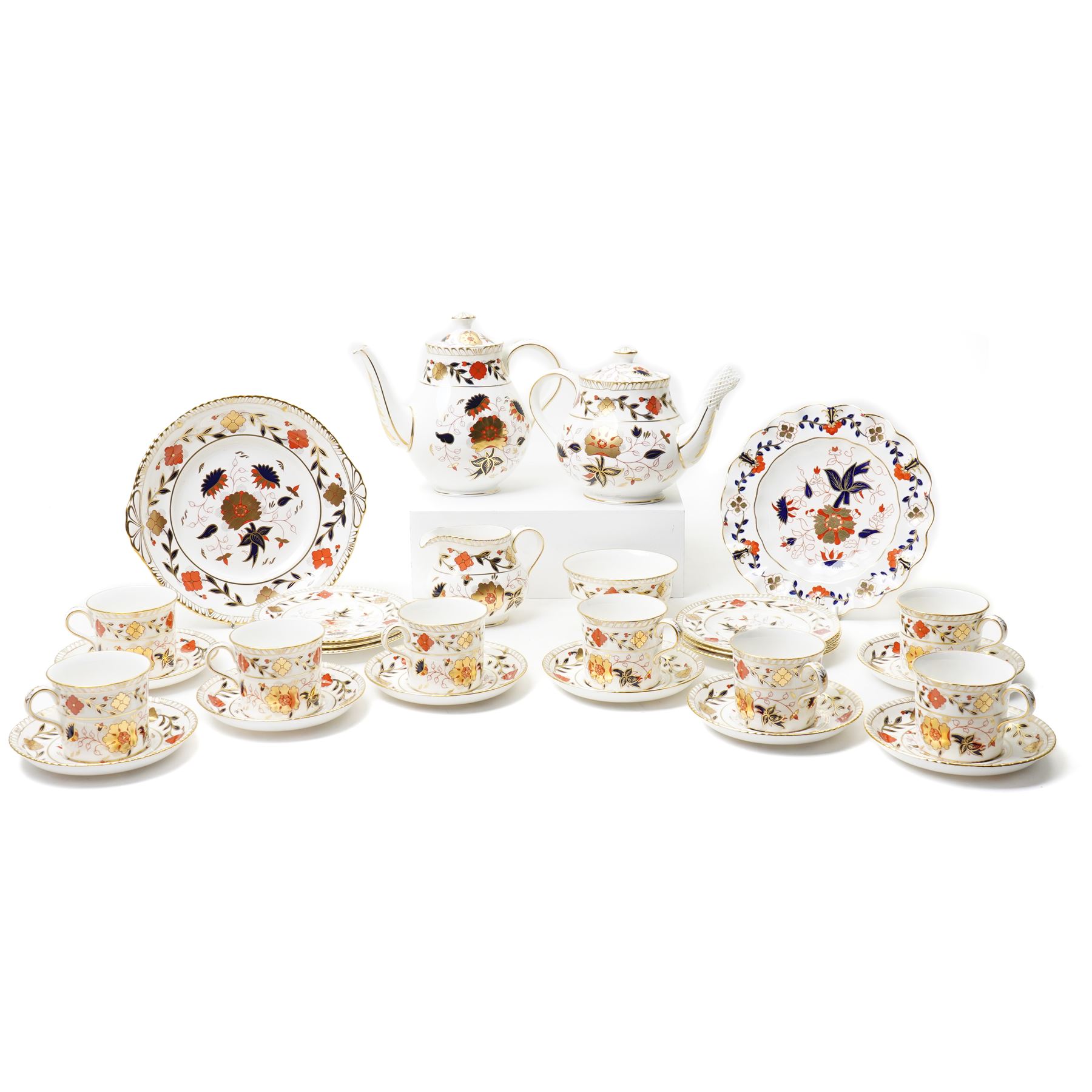 Royal Crown Derby 'Asian Rose' pattern A.962 tea service, comprising tea and coffee pots, open sucrier, milk jug, eight cups and saucers, six side plates, two serving plates, and a boxed Duck with gold stopper