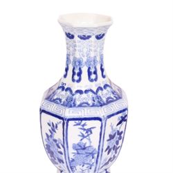 Pair of blue and white vases, of octagonal form, decorated with panels of blossoming branches, H36cm