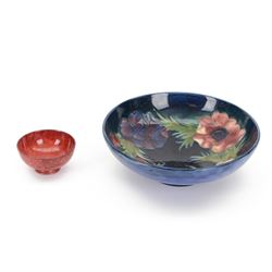 Moorcroft bowl in Anemone pattern upon a blue ground, with printed and painted mark beneat...