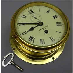  Ship's brass cased bulkhead clock, the cream 'Roman dial inscribed Castle & Co Hull and subsidiary seconds dial, D20cm   
