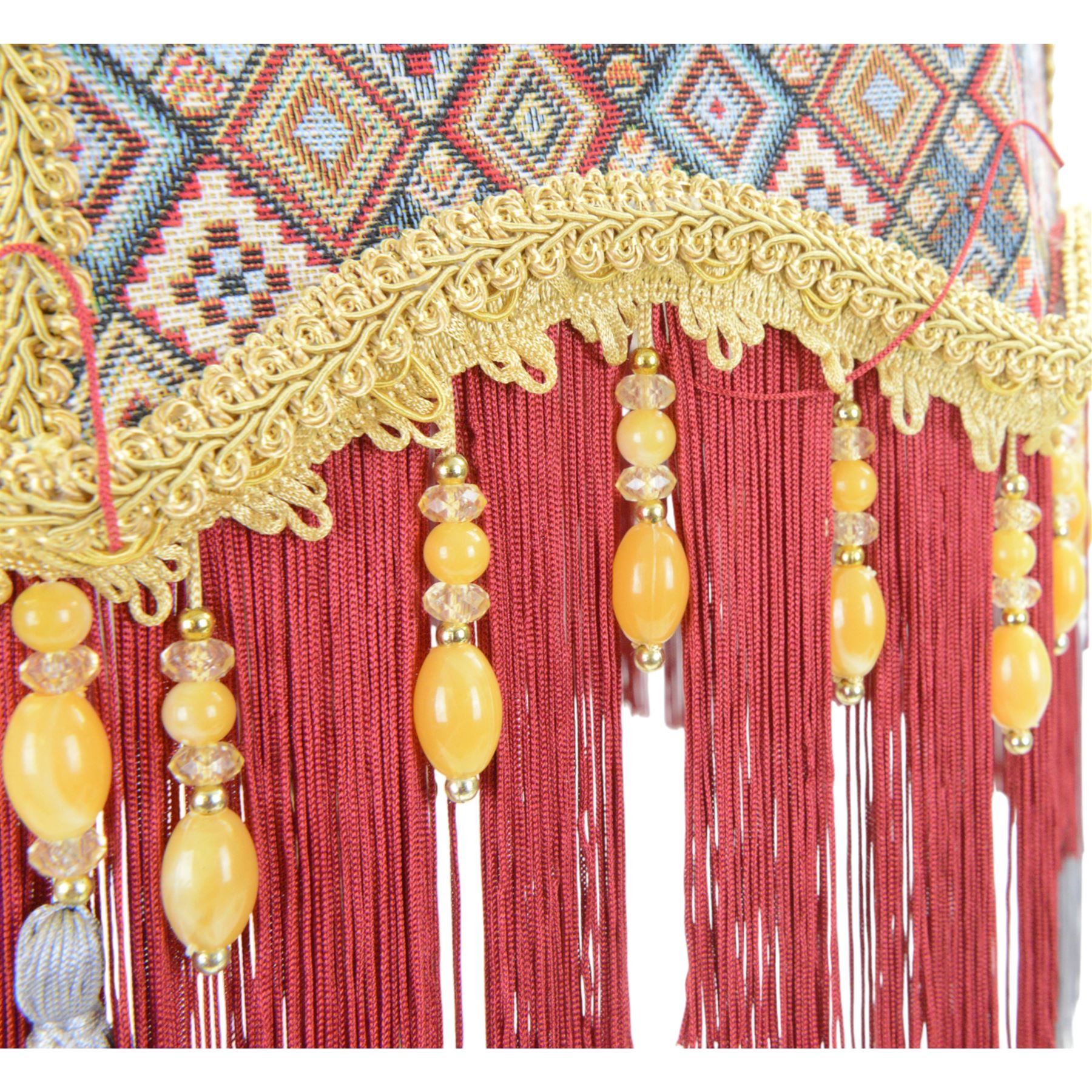 Gilt table lamp, three lion paw feet on a triangular base with column central support decorated with floral motifs, with octagonal shade, H85cm 