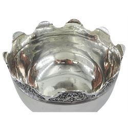 Late Edwardian silver Monteith bowl, the plain body with moulded foliate detailed and shaped rim, upon a circular stepped foot, hallmarked Selfridge & Co Ltd, London 1908, H17cm D21.5cm, approximate weight 31.64 ozt (984.4 grams)
